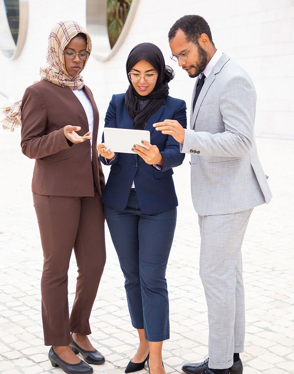 successful business group watching content tablet outside 1