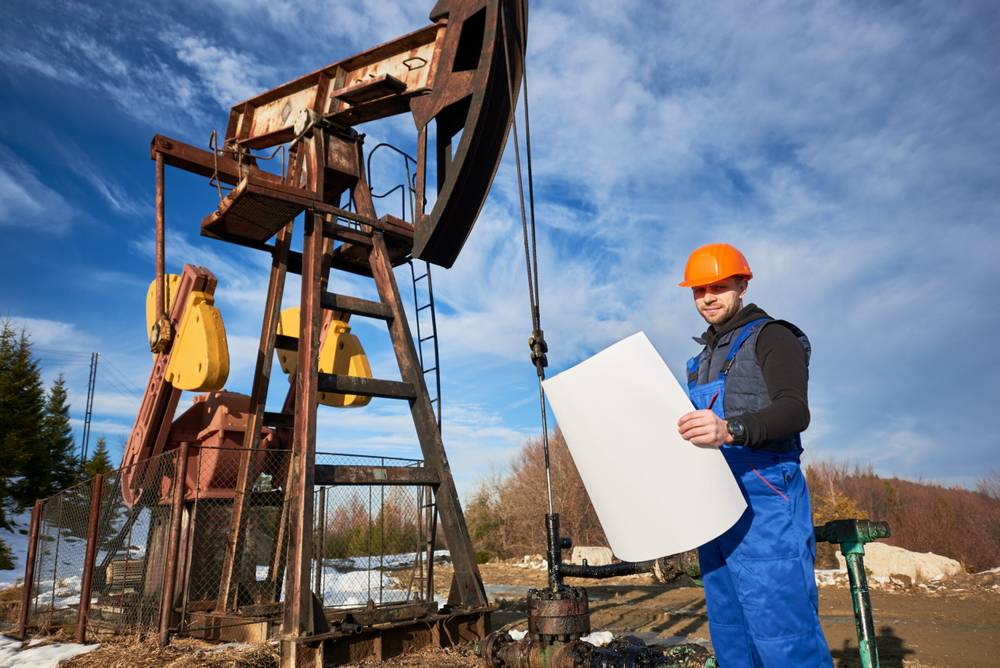 What is the Average Salary in the Petroleum Industry? 1 oil man controlling work pump jack scaled